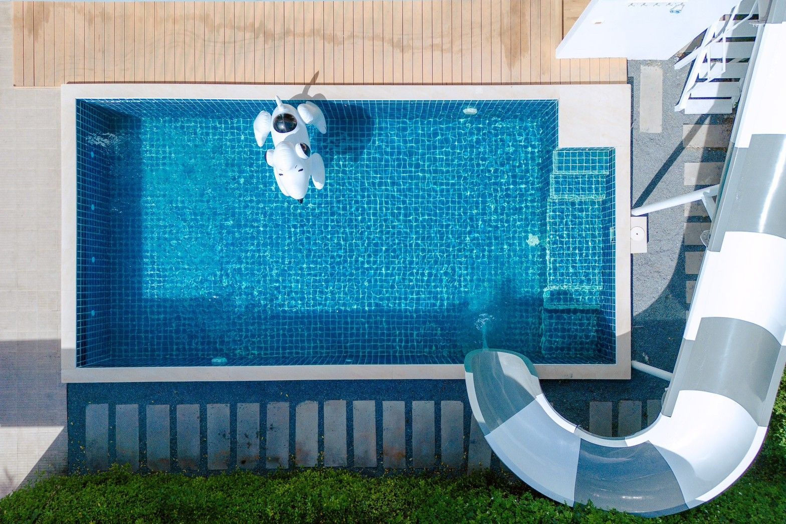 Aerial view of the pool and waterslide at Pool Lay AI Pool Villa, Na Jomtien, Pattaya.
