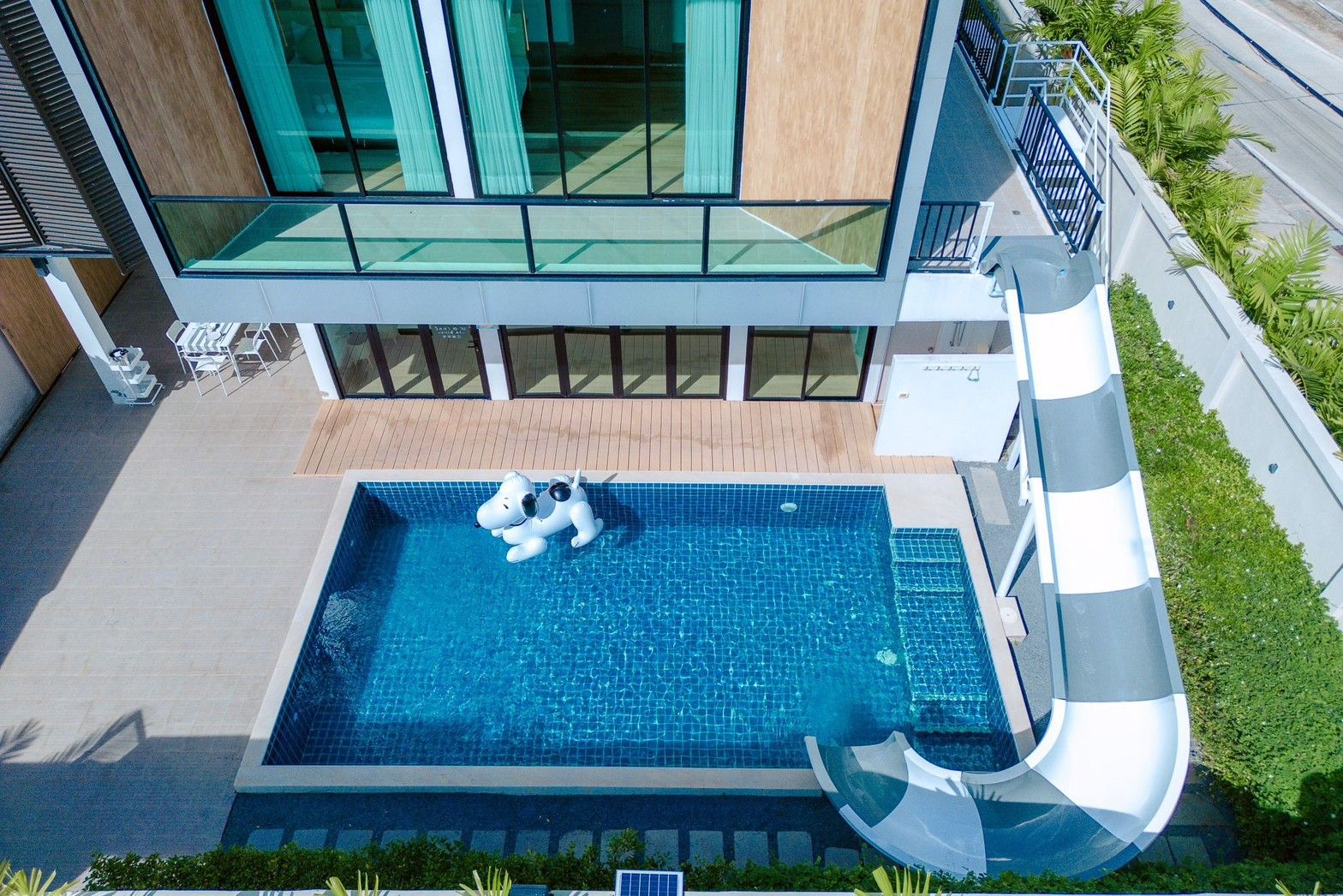 Aerial view of the pool and waterslide at Pool Lay AI Pool Villa in Na Jomtien, Pattaya.