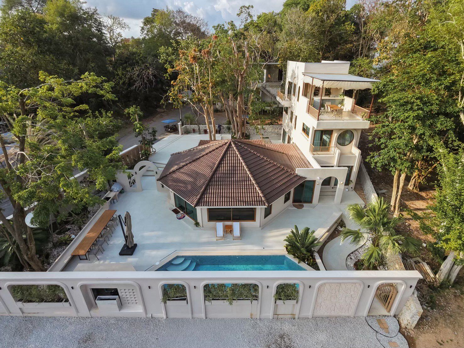 Aerial view of Sand Moment VI Pool Villa in Rayong, showcasing the entire property, pool, and surrounding lush greenery.