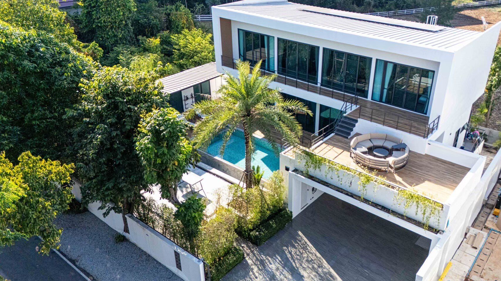 Aerial view of Sea Moment IV Pool Villa in Rayong, showcasing its modern architecture, private pool, and lush surroundings.