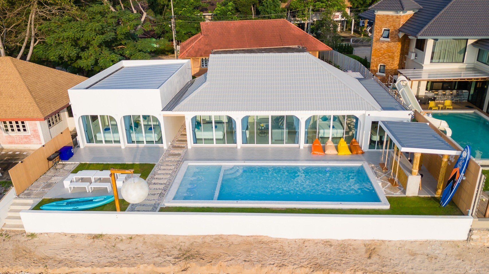 Aerial view of Sun Sea V Pool Villa, pool, and beachfront