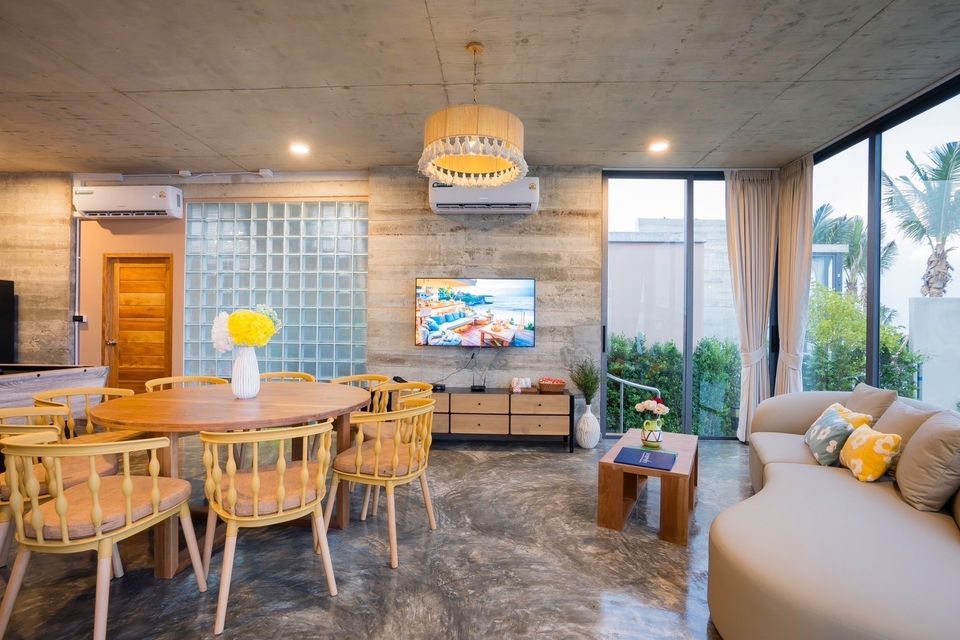 Amore' B Pool Villa, Cha-Am open plan living and dining area with modern decor and natural light.