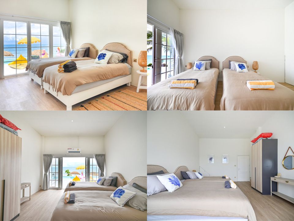 Coastal Calm IV Pool Villa in Cha-Am offers a bright bedroom with two twin beds and direct sea views from large glass doors.