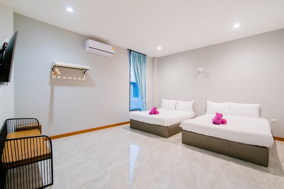 Bedroom with double and single beds at Exclusive Proud VII Villa in Hua Hin