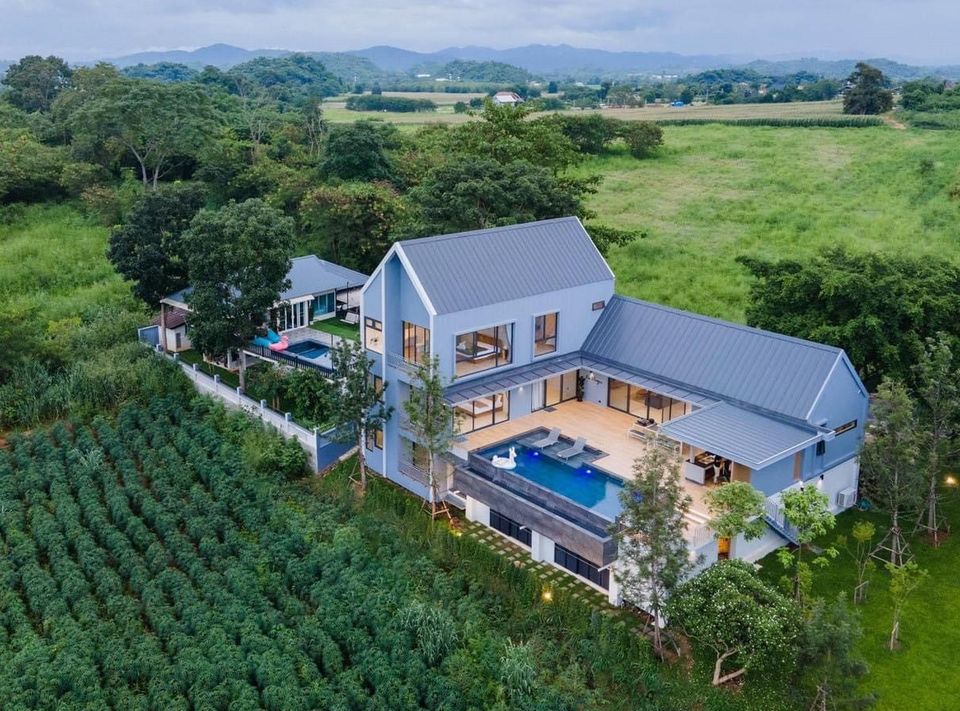 Aerial view of Kin Khaoyai V Pool Villa, หมูสี เขาใหญ่. Modern architecture, pool, and lush green surroundings.