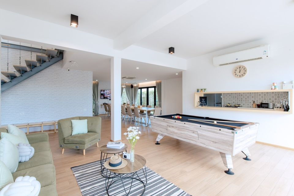 Bright open living space with billiards table at Pool Lay AI Pool Villa, Na Jomtien, Pattaya.