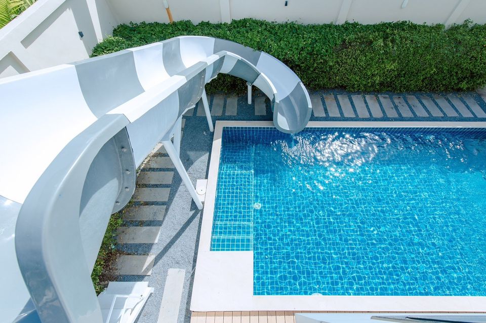 Aerial view of the pool with waterslide at Pool Lay AI Pool Villa, Na Jomtien, Pattaya.