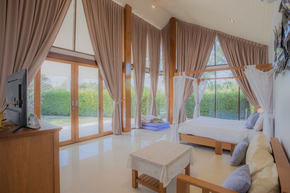 Spacious bedroom with garden view at Proud I Pool Villa, Hua Hin, Thailand