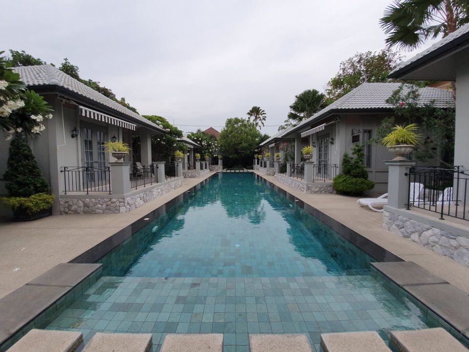 Long narrow pool between villas at Sala Haven Nine Pool Villa, South Pattaya, Thailand.