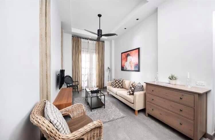 Bright living room with modern decor at Sala Haven Nine Pool Villa, South Pattaya, Thailand.