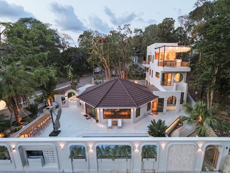 Aerial view of Sand Moment VI Pool Villa in Rayong, showcasing the entire property, pool, and surrounding lush greenery.