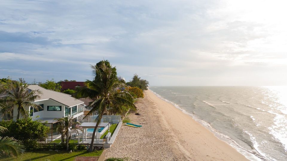 Aerial view of Sea Time V Pool Villa in Cha-Am, Thailand, showcasing its beachfront location and private pool.