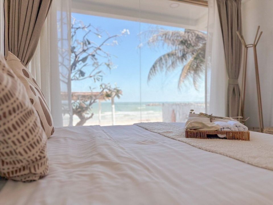 Bedroom with a comfortable bed and ocean view at Story II Pool Villa Hua-Hin, Thailand. Perfect for a relaxing stay.