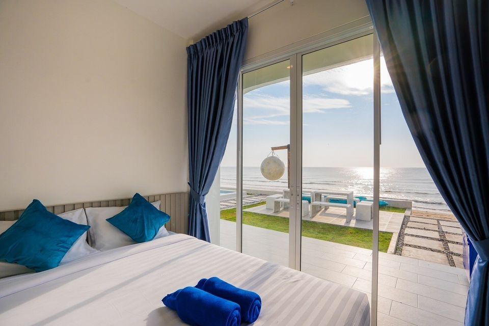 King bedroom overlooking the beachfront pool at Sun Sea V Pool Villa
