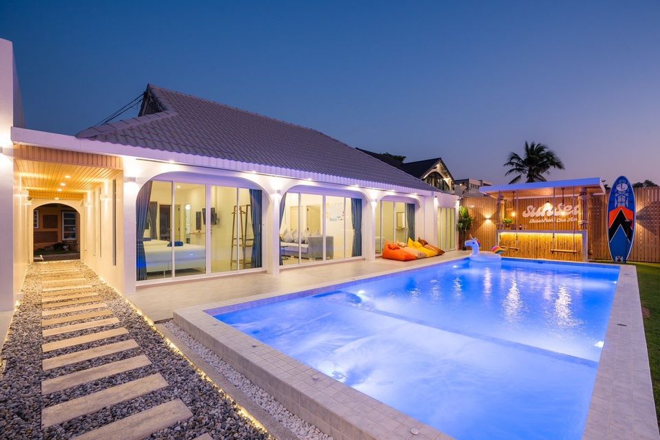 Illuminated villa and beachfront pool at Sun Sea V Pool Villa
